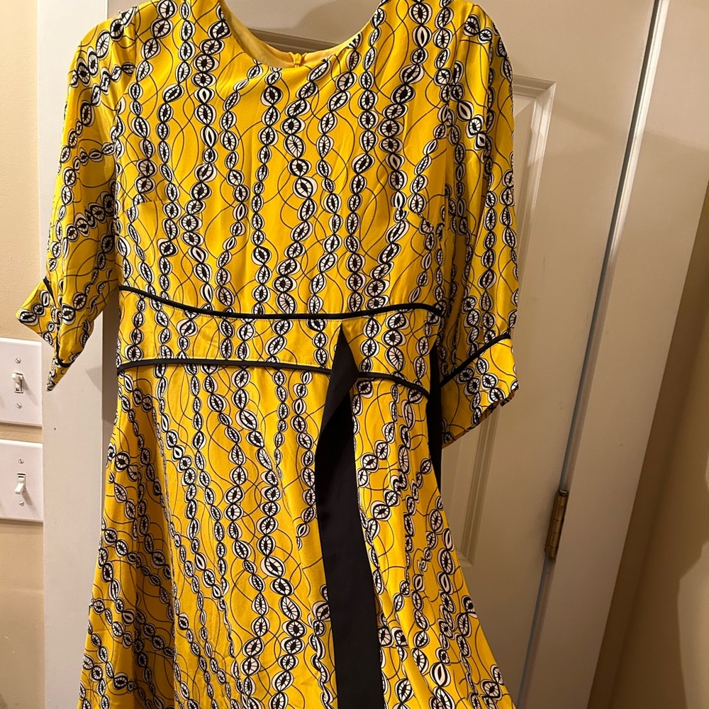 100% silk with synthetic lining flowy dress.